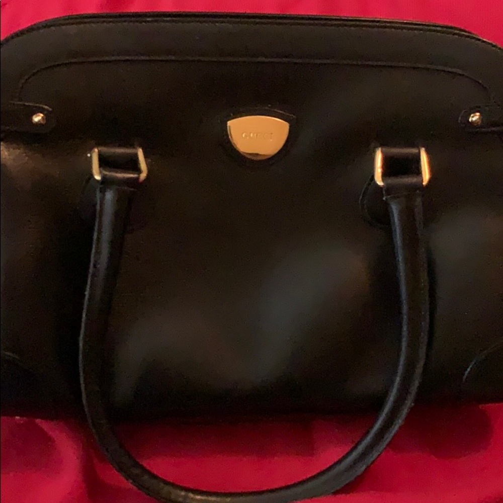 All black classic top handle purse